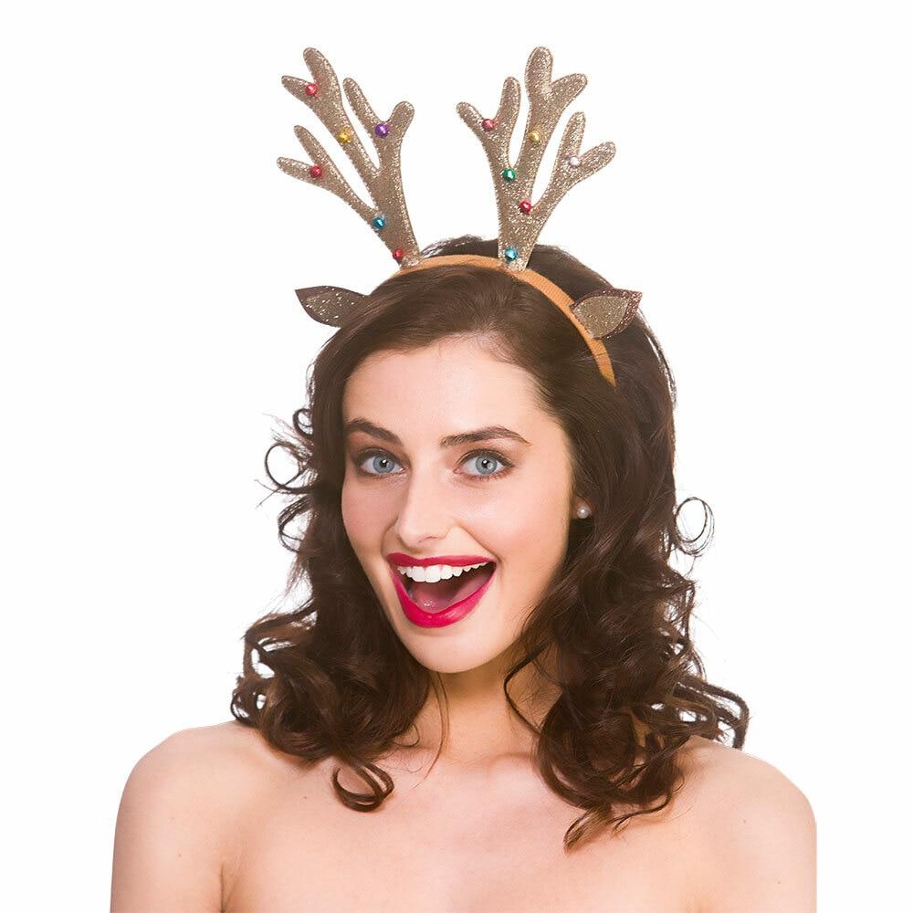 model wears gold glitter reindeer antler headband with multi coloured baubles